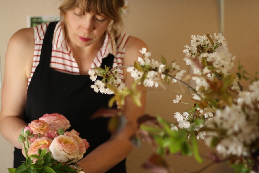 Anna demonstrating arranging ranunculus flowers